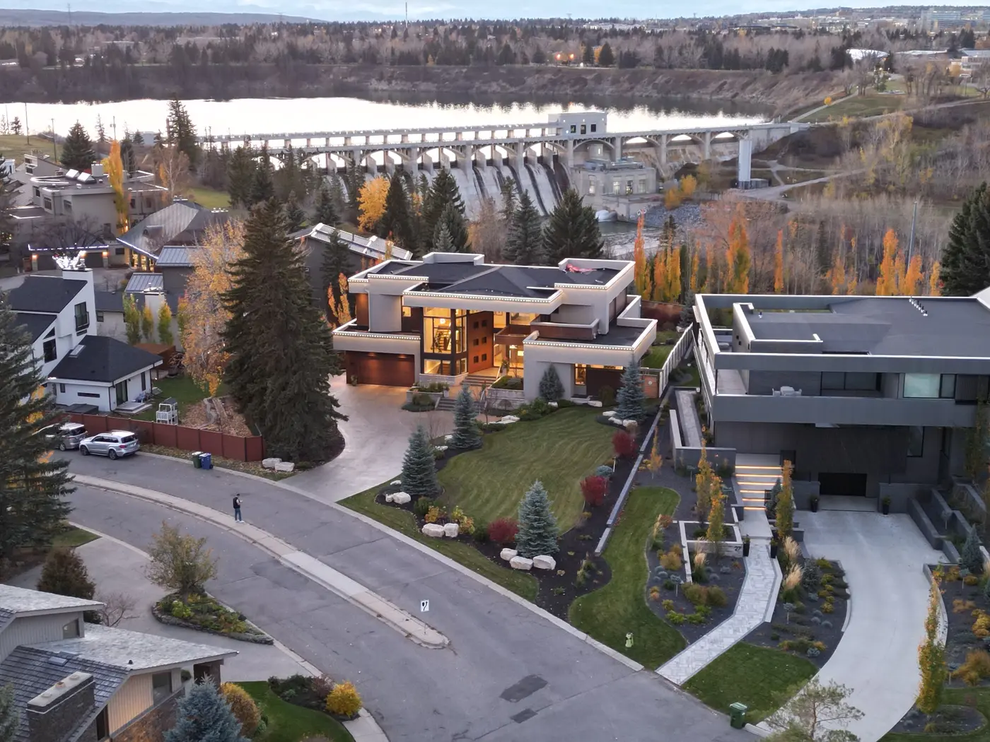 A wider aerial situates the residence on its quiet Bel-Aire cul-de-sac, the Glenmore dam and reservoir spread out directly behind the property.